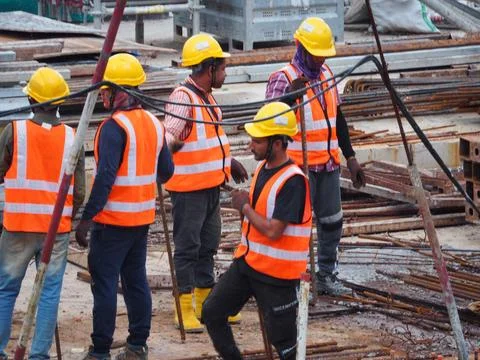 Foreign workers are working in a construction site Stock Photos