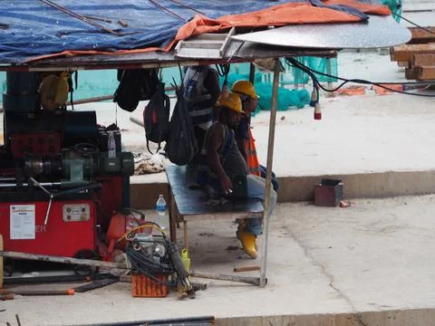 Foreign workers are working in a construction site Stock-Fotos