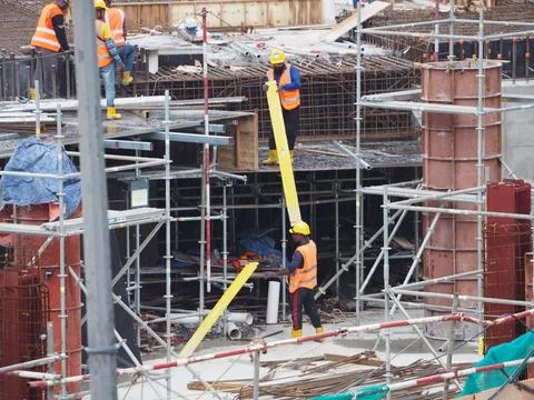 Foreign workers are working in a construction site Stock-Fotos