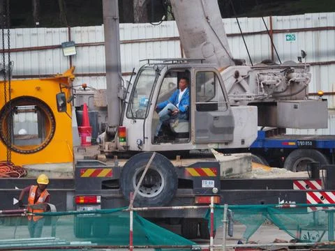 Foreign workers are working in a construction site Stock Photos