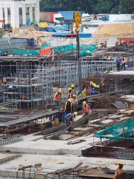 Foreign workers are working in a construction site Stock Photos