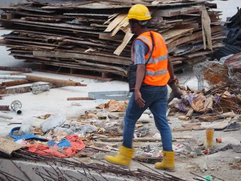 Foreign workers are working in a construction site Stock Photos