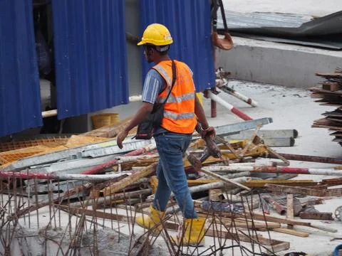 Foreign workers are working in a construction site Stock Photos