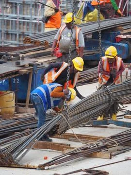 Foreign workers are working in a construction site Stock Photos
