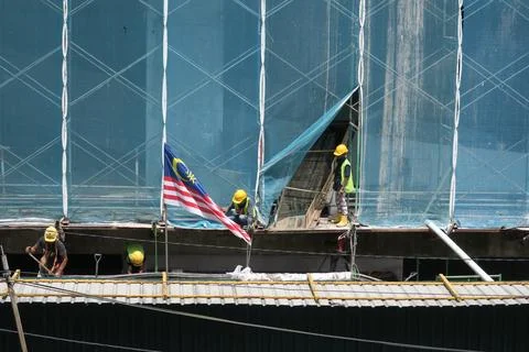 Foreign workers are working in a construction site Stock Photos