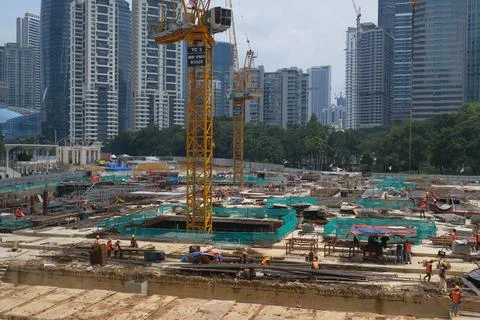 Foreign workers are working in a construction site Foto stock