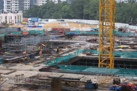 Foreign workers are working in a construction site Stock Photos