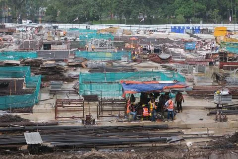 Foreign workers are working in a construction site Stock Photos