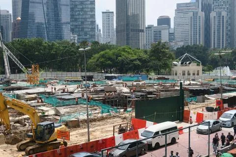 Foreign workers are working in a construction site Stock Photos