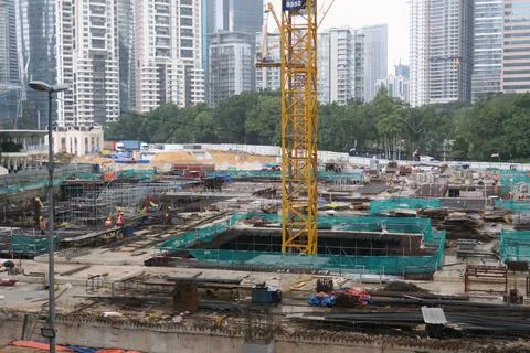 Foreign workers are working in a construction site Stock Photos