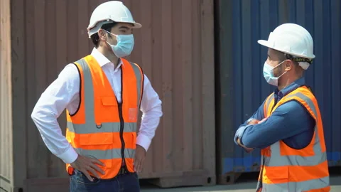 Foreman and engineer worker man wearing protective face mask bump elbows inst Stock Footage 156383739