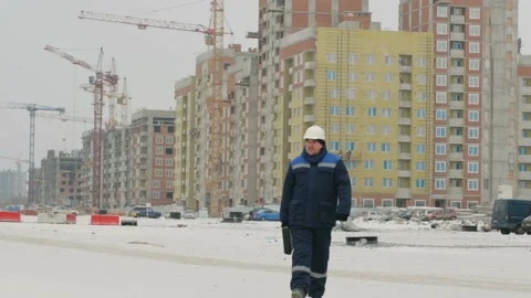 Foreman with brief case at major construction project Stock Footage 86927785