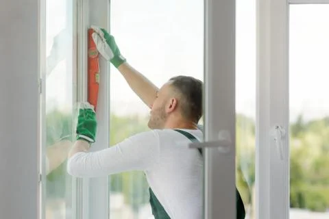 Foreman checking accuracy with a bubble spirit level Stock Photos