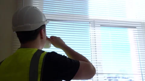 A foreman civil engineer oversees the project and drinks from a mug Stock Footage 155068290