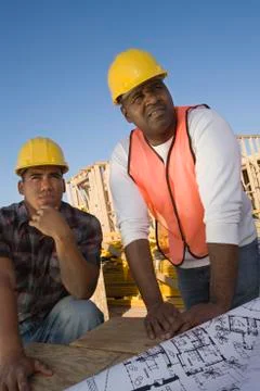 Foreman With Co-Worker Looking At Framework Stock Photos