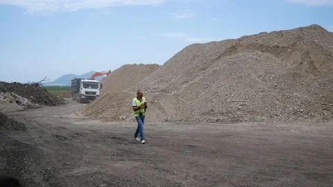 Foreman on construction site with camera in hands. Russia, Stavropol, 10.06.20 Stock Footage 144243905
