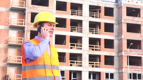 Foreman on construction site talking to real estate developer, presenting status Stock Footage 58513779