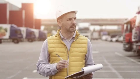 Foreman control loading Containers box to truck for Logistic Import Export Stock Footage 111481259