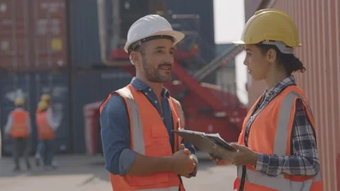 Foreman control loading Containers box of cargo explain work with young worker Stock Footage 149308777