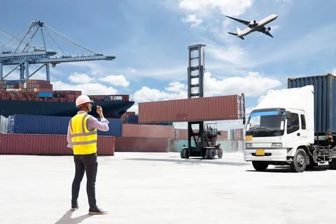 Foreman control loading Containers box Stock Photos