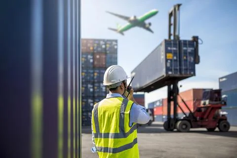 Foreman control loading Containers box Stock Photos