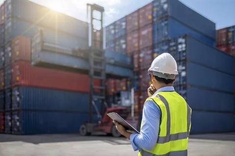 Foreman control loading Containers box Stock Photos