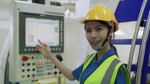 Foreman explaining the operation of the factory machinery control panel Stock Footage 140347297