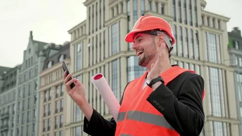 Foreman with gadget working at construction site Stock Photos