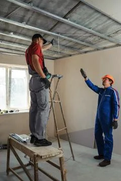 Foreman gives instructions to workers Stock Photos