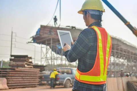 Foreman holding tablet use technology inspection control construction archite Stock Photos