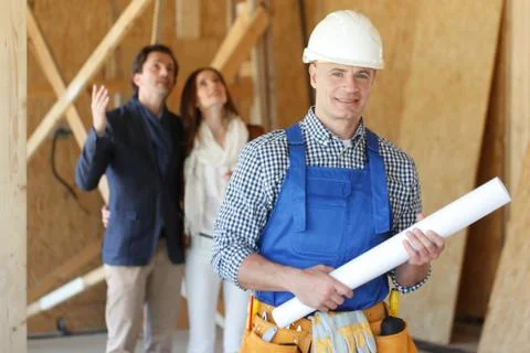 Foreman with house design plans Stock Photos