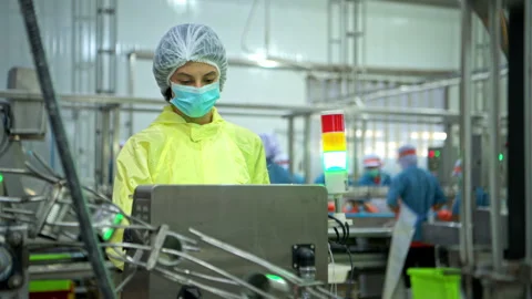 The foreman is inspecting the can conveyor line and recording data Stock-Footage 339046598