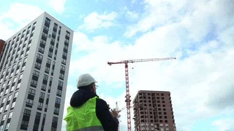 The foreman inspects the house under construction Stock Footage 156520484