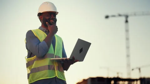 Foreman with laptop in construction site, portrait of african american man Stock Footage 318343076