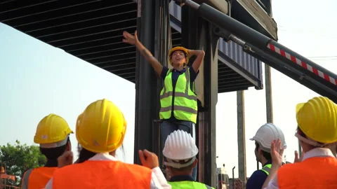 Foreman manager standing on forklift excited and raised hand up to success in Stock Footage 157716971