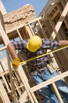 Foreman Measuring Framework At Construction Site Stock Photos