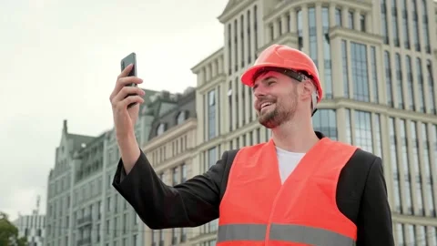 Foreman with modern gadget working at construction site Stock Footage 270222088
