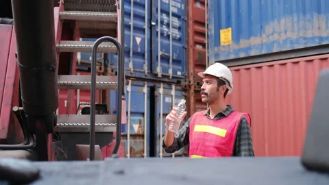 Foreman or cargo container worker use walkie talkie to other co-worker Stock-Footage 146713819