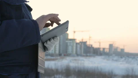 Foreman with pad at major construction project Stock Footage 86929849