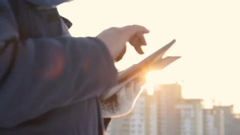 Foreman with pad at major construction project Stock Footage 86929917