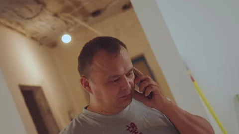 The foreman is on the phone, the man is on the phone Stock Footage 284035331