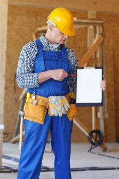 Foreman pointing at folder plate Stock Photos