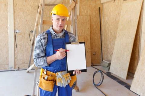Foreman pointing at folder plate Stock Photos