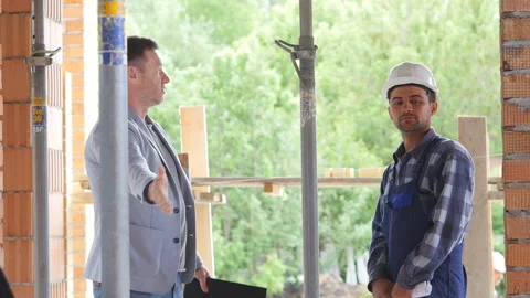 Foreman scolds employee for bad work done Stock Footage 91124614
