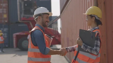 Foreman shake hand with worker and control loading Containers box of cargo Stock Footage 149308759