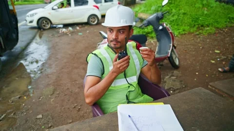 Foreman sits having coffee in safety attire Stock Footage 297600832