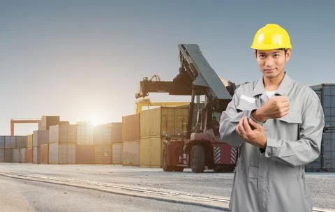 Foreman stand on front forklift loading Containers box Stock Photos