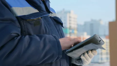 Foreman with tablet computer at major construction project Stock Footage 86930024