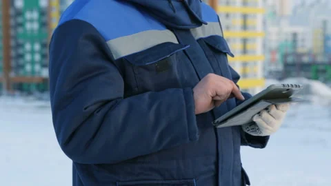 Foreman with tablet computer at major construction project Video stock 86930026