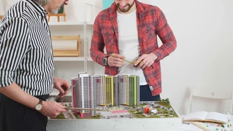 Foreman takes lessons by professional experienced architect. Stock Footage 127036890